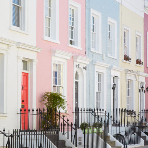 Colorful English houses facades, pastel pale colors in London